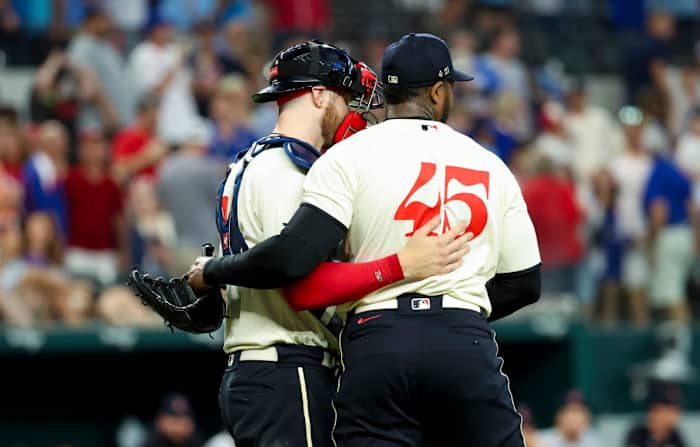 Jul 15, 2023; Arlington, Texas, USA; Texas Rangers relief pitcher Aroldis Chapman (45) and Texas Rangers catcher Jonah Heim (28) celebrate after the game against the Cleveland Guardians at Globe Life Field. Mandatory Credit: Kevin Jairaj-USA TODAY Sports